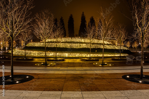 Night city park in the city of Krasnodar, Russia. The park is made in the same design style and contains a lot of geometry and rhythms. Stadium Krasnodar holds world football championships.