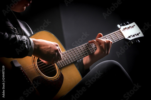Young men playing the guitar