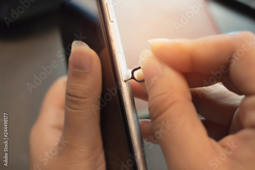 Employees are putting nano SIM cards in the store for customers to buy. photo