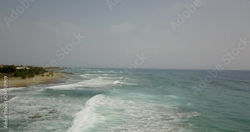 beautiful view from the top of the ocean with waves photo