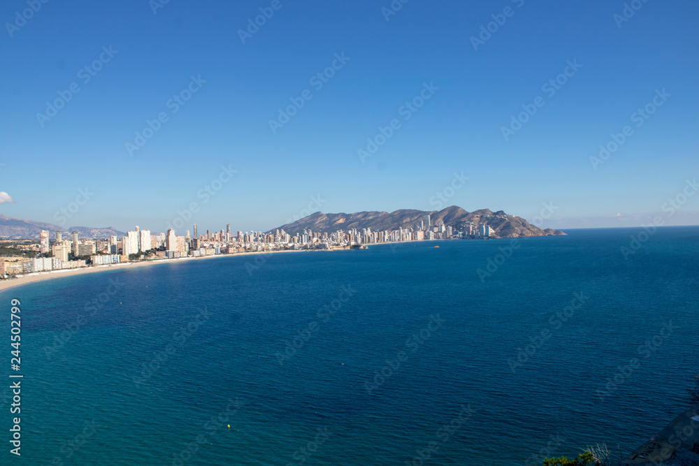 Aerial photo taken in Benidorm in Spain Alicante, showing the beautiful beach of Playa Levante and hotels, buildings, and high rise skyline cityscape.