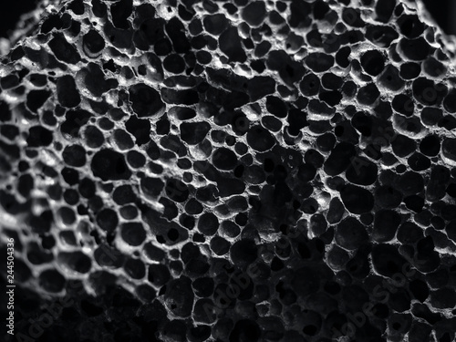 Black stone Porous texture Nature Abstract background photo