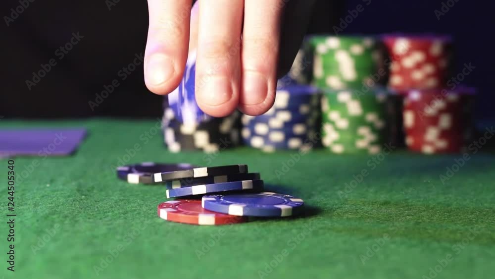 Poker chips on a green table Poker chips on a green table