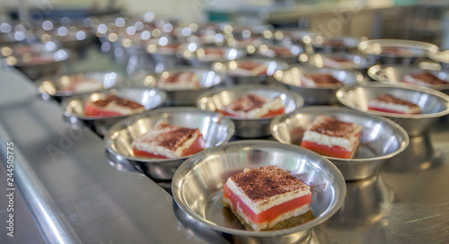 There are lots of desserts in a school canteen. Kids will be having a break soon and will come and have a snack.