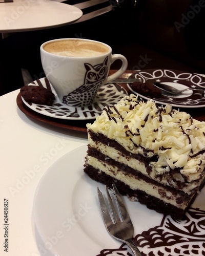 cup of coffee and cake on plate