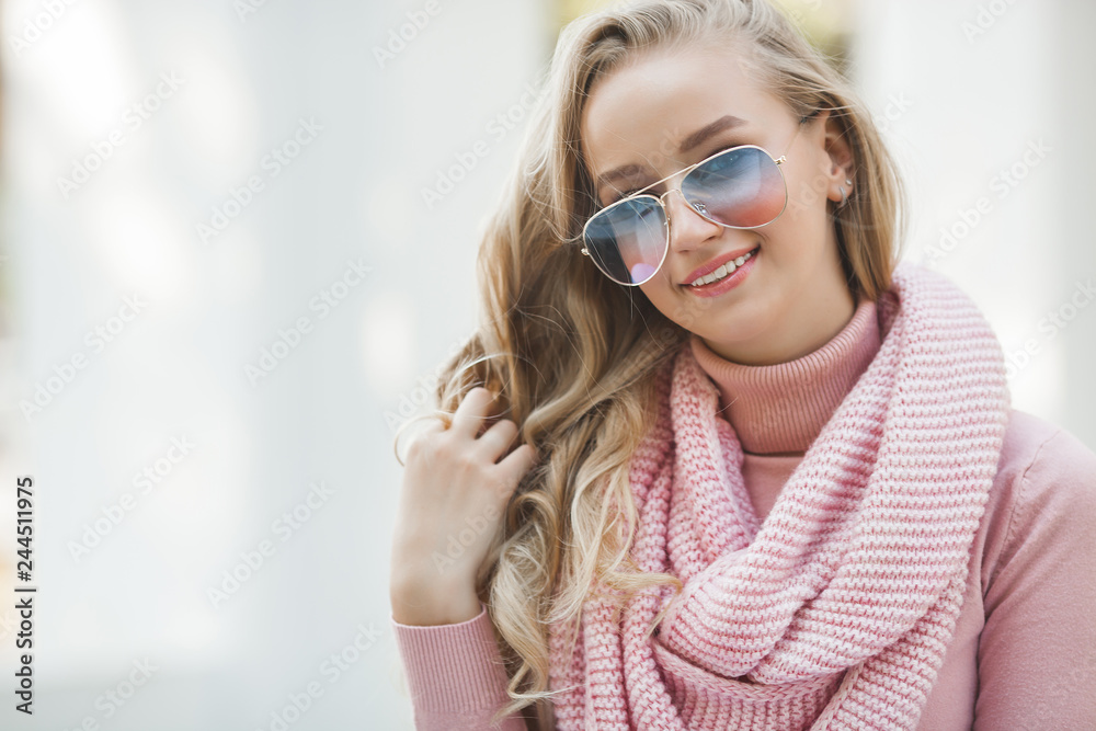 Naklejka premium Close up portrait of young beautiful woman outdoors. Lady on spring background. Attractive girl on autumn or fall background. Urban woman.