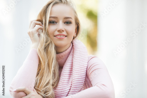 Close up portrait of young beautiful woman outdoors. Lady on spring background. Attractive girl on autumn or fall background. Urban woman.