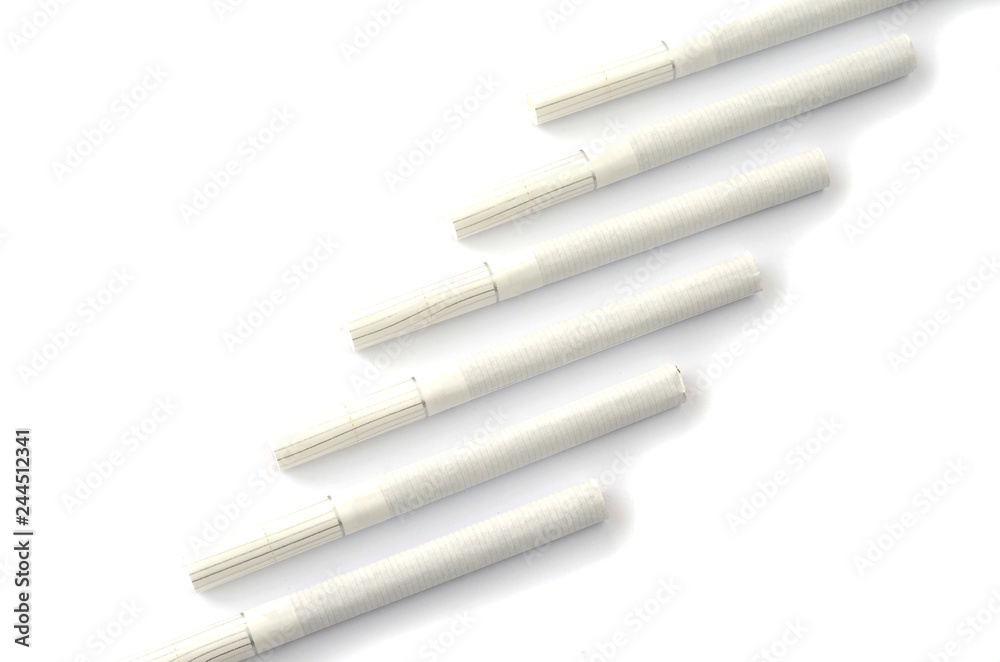 Fototapeta premium Cigarettes in different position on a white background.