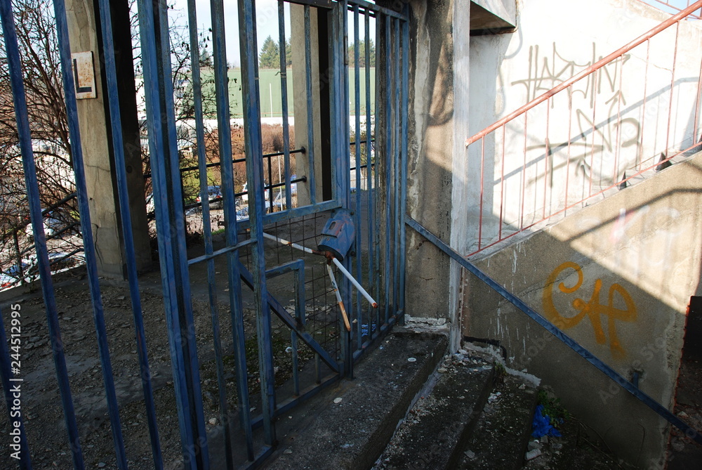 A broken entrance into tribunes of abandoned and decay football stadium in Brno A broken entrance into tribunes of abandoned and decay football stadium in Brno