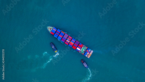 Container ship carrying container for import and export, business logistic and transportation by ship in open sea, Aerial view cargo container ship. © Kalyakan