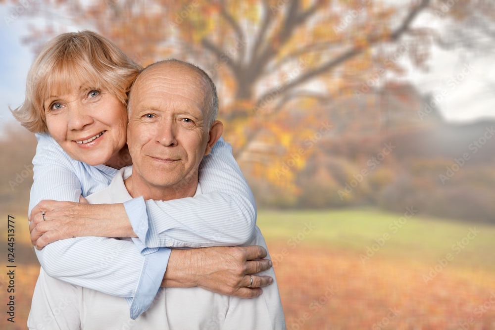 Fototapeta premium Portrait of happy senior couple smiling