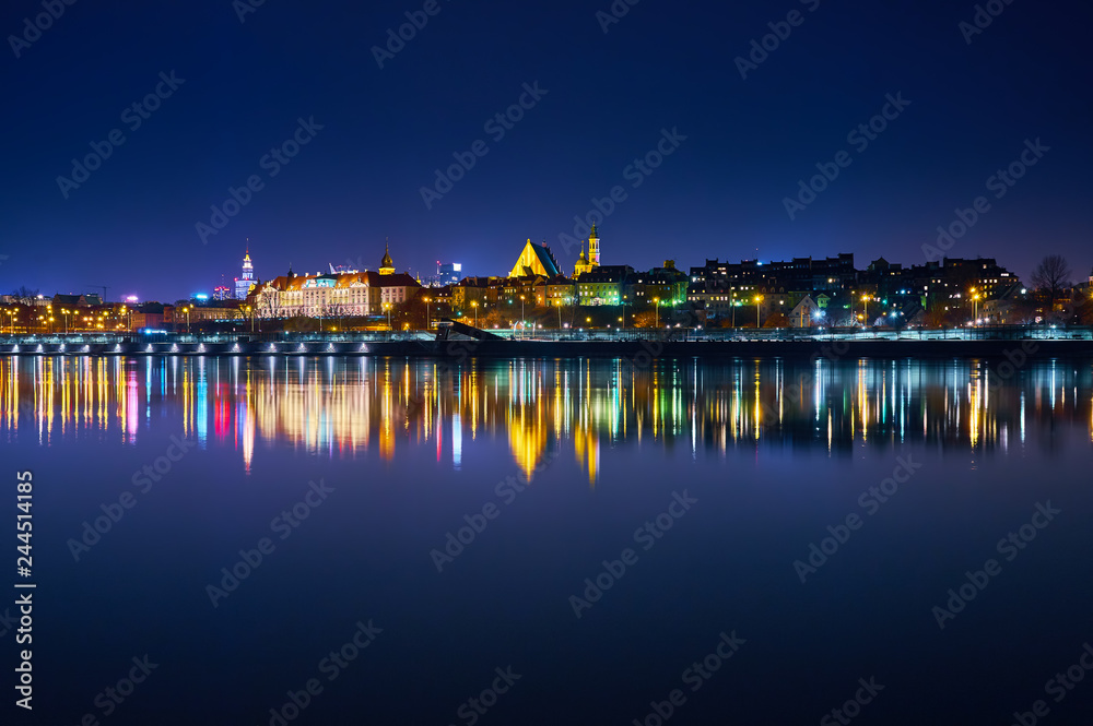 Warsaw, Poland - March 21, 2017: Great panoramic night view of the center and the Old City of Warsaw from the right bank of the Vistula River