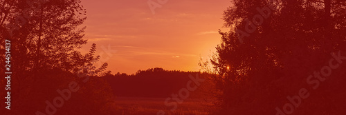 Sunset in the meadow, countryside landscape. Web banner for design.