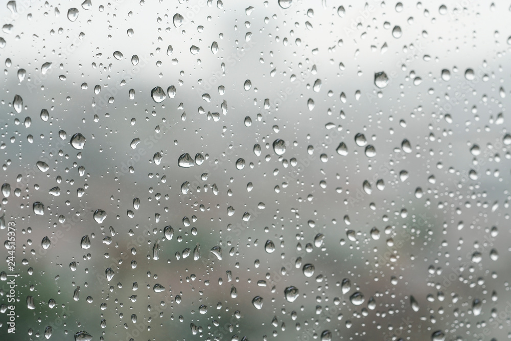 Rain drops on a window pane in a rainy day