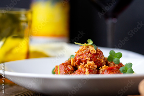 Meat meatballs in tomato sauce with mashed potatoes on a white plate, Swedish cuisine