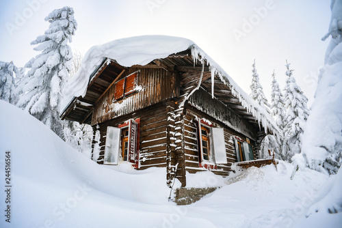 Fototapeta Naklejka Na Ścianę i Meble -  Chateau in the winter mountains, a hut in the snow. Winter mountain landscape. Karkonosze, Poland.