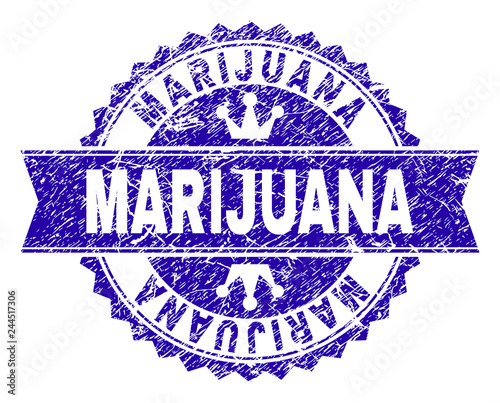 MARIJUANA rosette stamp seal imprint with grunge texture. Designed with round rosette, ribbon and small crowns. Blue vector rubber print of MARIJUANA tag with grunge texture.