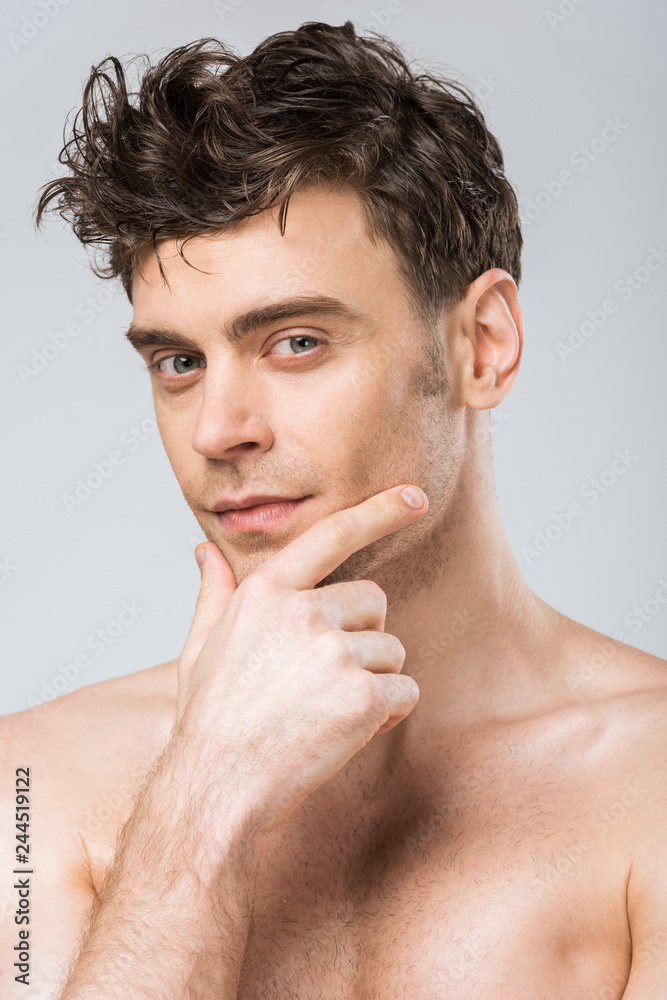 portrait of handsome young thoughtful man isolated on grey portrait of handsome young thoughtful man isolated on grey