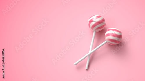 Two sweet striped pink and white lollipops on stick on bright pink background photo