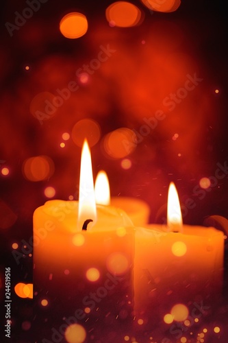 Candles light. Christmas candles burning at night. Abstract