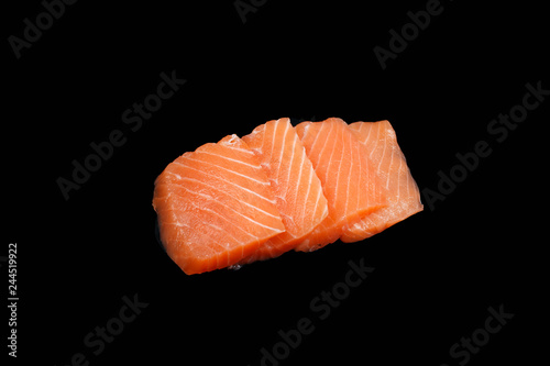 sliced ​​raw salmon on black background