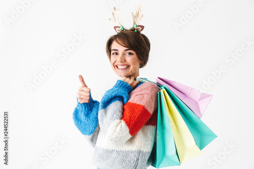 Happy cheerful girl wearing sweater standing