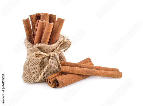 dried cinnamon stick in sack and on white background photo