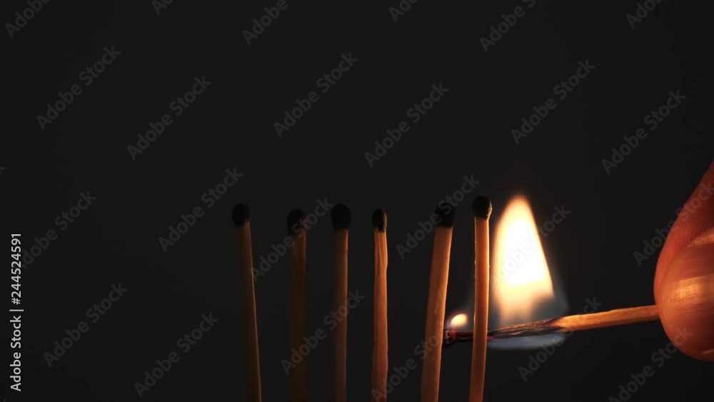 matches sulfur burn with a red flame on a dark background matches sulfur burn with a red flame on a dark background