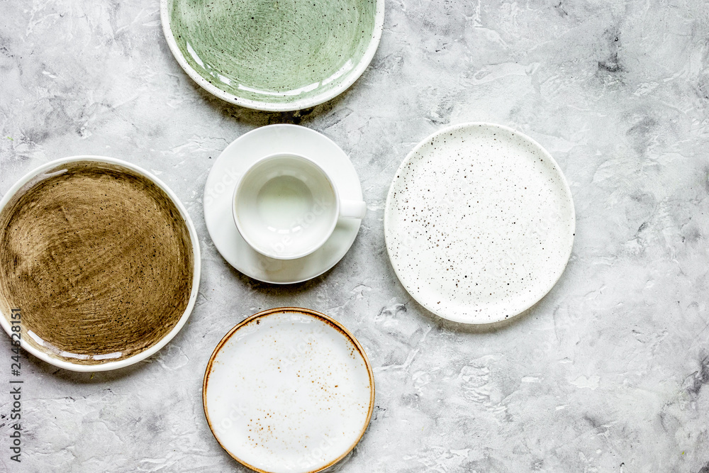 ceramic tableware top view on stone background mock up