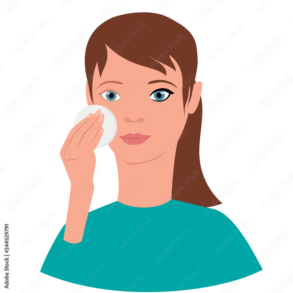 young girl removes makeup from the face with a cotton pad with lotion young girl removes makeup from the face with a cotton pad with lotion