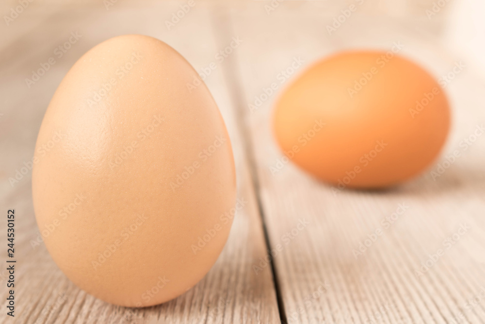 Chicken eggs on a wooden table. Selective focus. Chicken eggs on a wooden table. Selective focus.