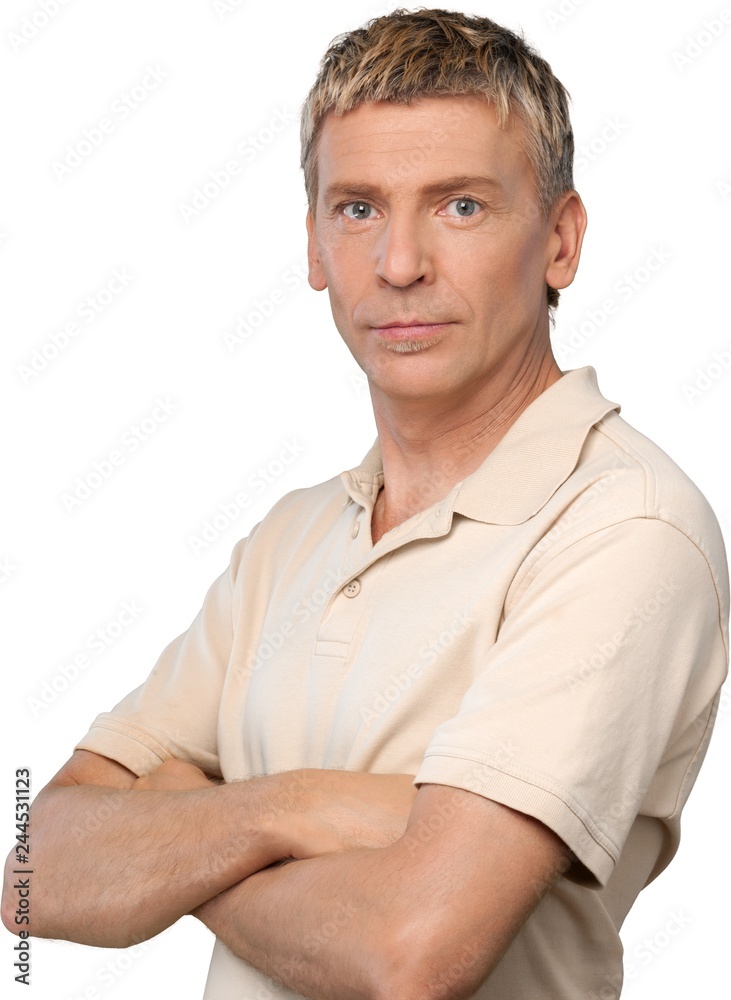 Casually dressed man with his arms folded in front of him Casually dressed man with his arms folded in front of him