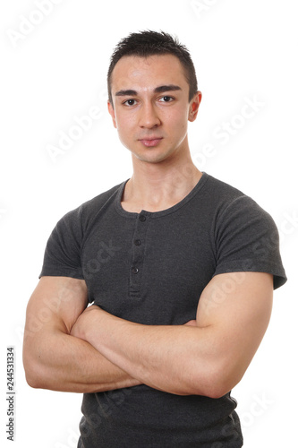 Photography young man with muscular arms folded or crossed isolated on white