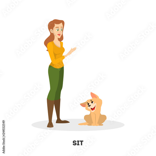 Woman training her pet dog. Sit command