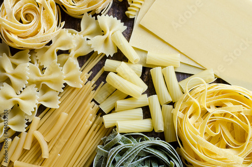 Variety of types and shapes of Italian pasta photo