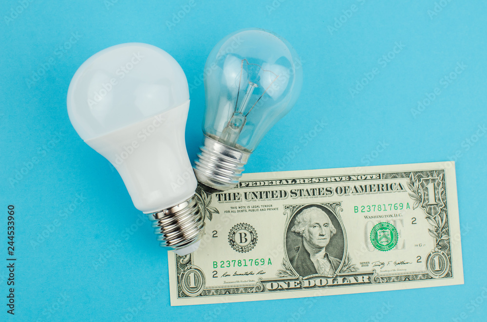 incandescent lamp and energy saving on a blue background incandescent lamp and energy saving on a blue background
