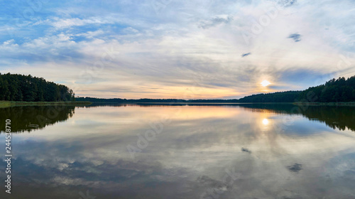 Fototapeta Naklejka Na Ścianę i Meble -  Beautiful panoramic view of the sunset over Lemiet lake in Mazury district, Poland. Fantastic travel destination.