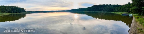 Beautiful panoramic view of the sunset over Lemiet lake in Mazury district, Poland. Fantastic travel destination.