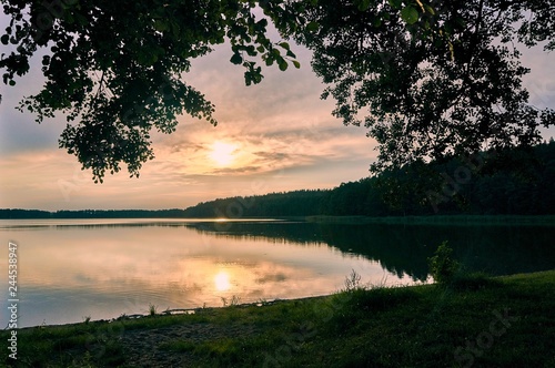 Beautiful panoramic view of the sunset over Lemiet lake in Mazury district, Poland. Fantastic travel destination.