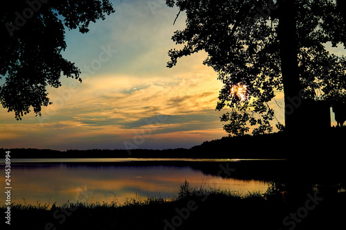 Fototapeta Naklejka Na Ścianę i Meble -  Beautiful panoramic view of the sunset over Lemiet lake in Mazury district, Poland. Fantastic travel destination.