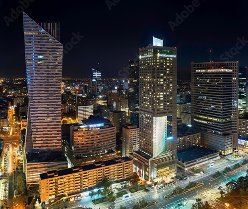 Warsaw, Poland - August 27, 2016: Aerial panoramic view to downtown of Polish Capital by night, from the top Palace Culture and Science: Palac Kultury i Nauki, also abbreviated PKiN.