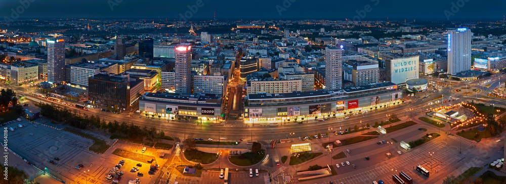 Fototapeta premium Warsaw, Poland - August 27, 2016: Aerial panoramic view to downtown of Polish Capital by night, from the top Palace Culture and Science: Palac Kultury i Nauki, also abbreviated PKiN.