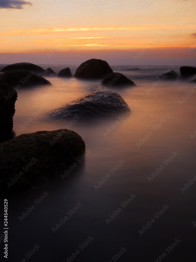 Colorful sunset Seascape.Beautiful sunset with natural rocks salty water,Long exposure