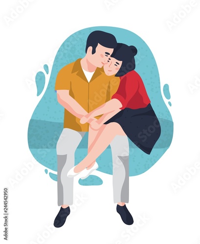 Young smiling man and woman sitting together and cuddling. Cute funny boy and...