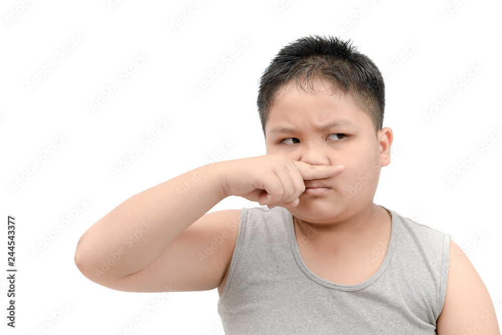 Fat boy covering his nose because of a bad foul smell Fat boy covering his nose because of a bad foul smell