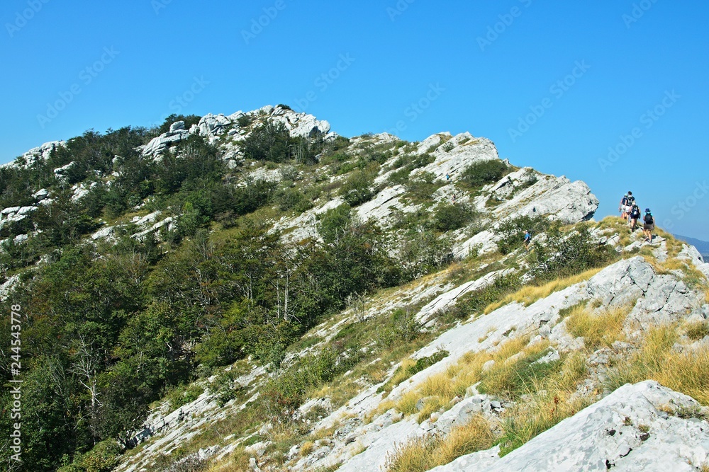 Croatia-view of the tourists and mountains in the Velebit National Park Croatia-view of the tourists and mountains in the Velebit National Park