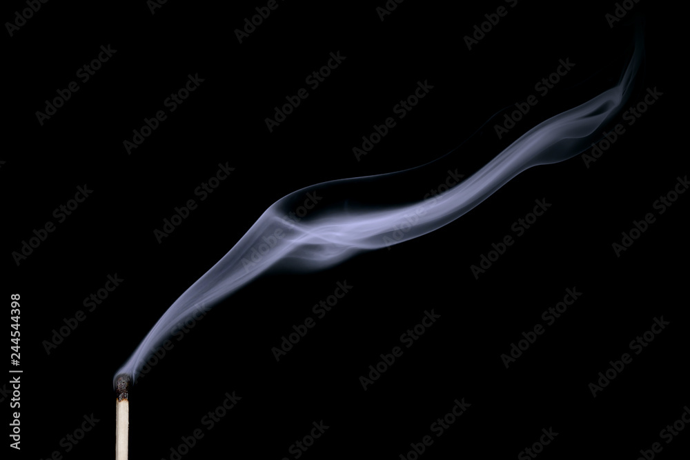 Smoke from a put out match isolated on black background Smoke from a put out match isolated on black background