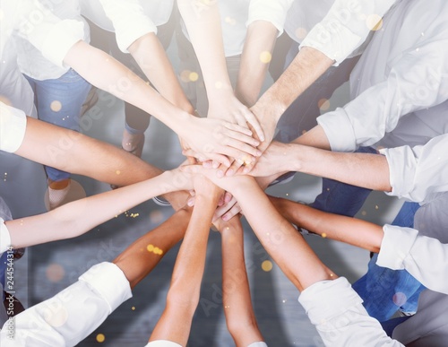 Foto Group of people stacking hands together