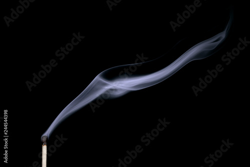 Smoke from a put out match isolated on black background