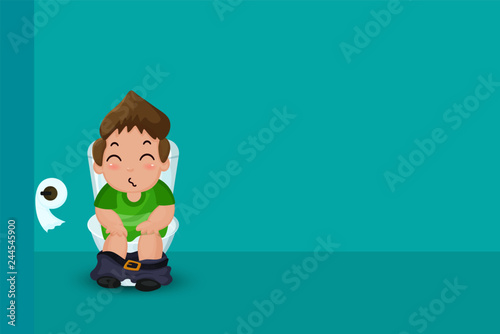 Waste excretion. The boy was sitting on the toilet happily.
